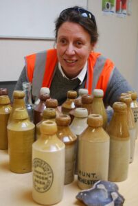 Dr Tetlow with the bottles found at the site