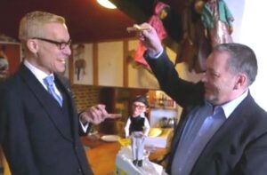 David presents Mark with his puppet