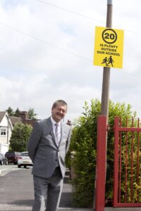 Councillor Mark Deaville by a speed indicator device