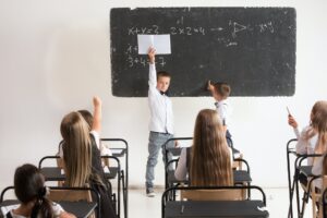 School children in classroom at lesson