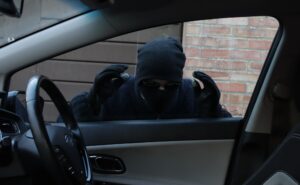 Thief looking in through car window