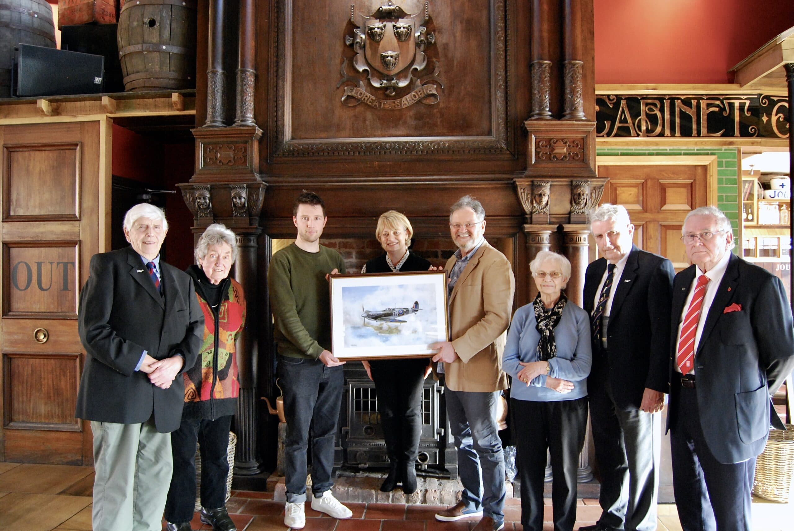 CWT trustee Leo Capernaros (3rd left) in the Joule's Crown Wharf pub with members of the Star of Stone Spitfire Group, including artist Charles O'Neill (4th right) and group lead Geoff Berriman (2nd right)
