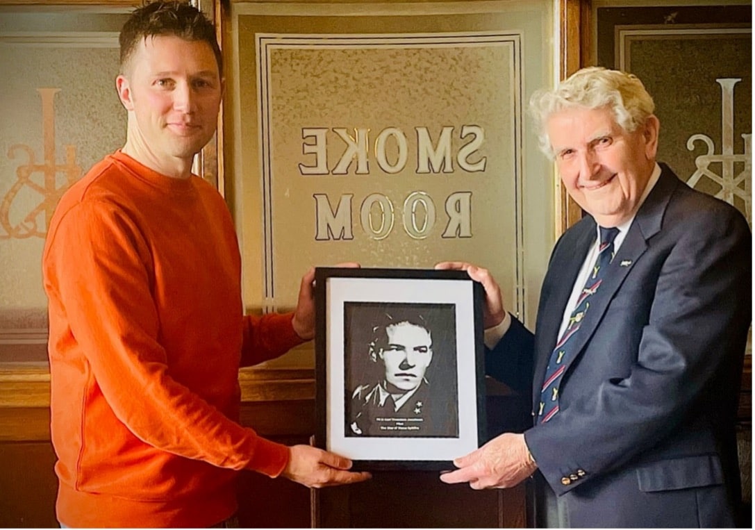 Geoff Berriman, right, presents the photograph to Crown Wharf Theatre trustee Leo Capernaros