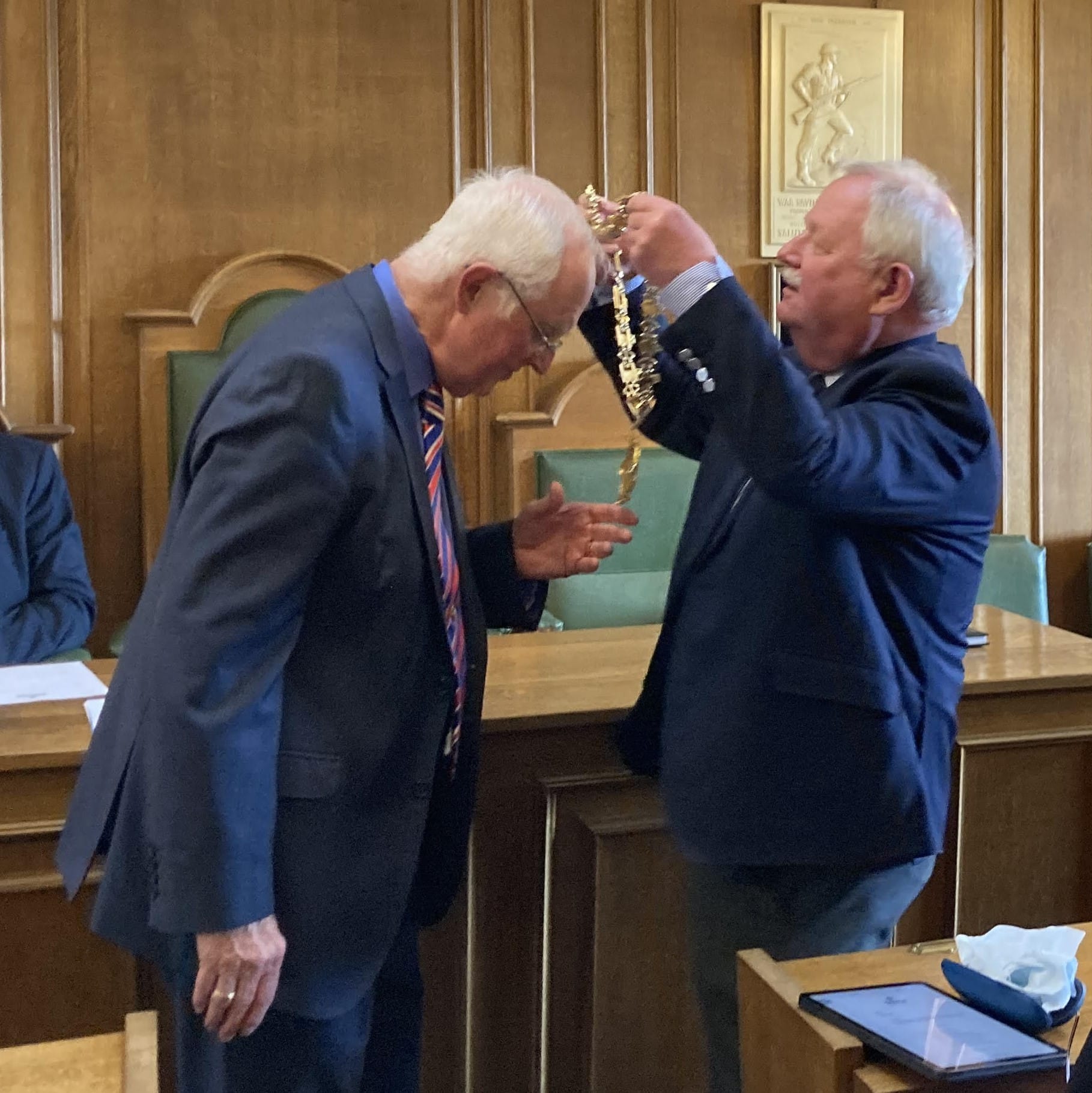 Stone's new Mayor Philip Leason receives the chain of office from Councillor Jim Davies