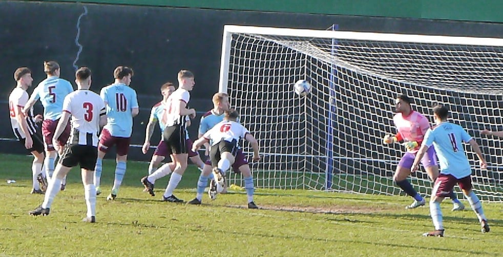 The ball is going in the net