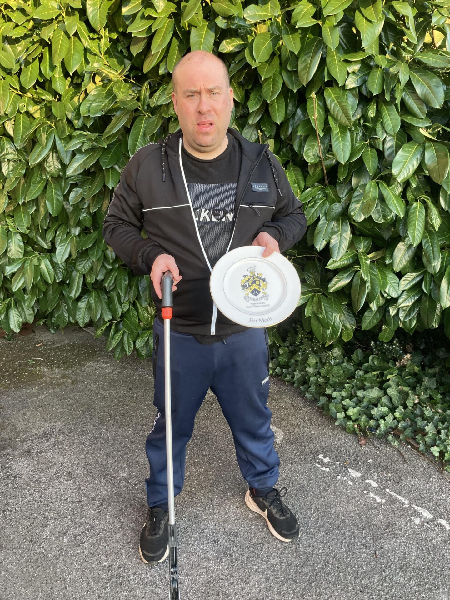 Jason with his trusty litter picker and award