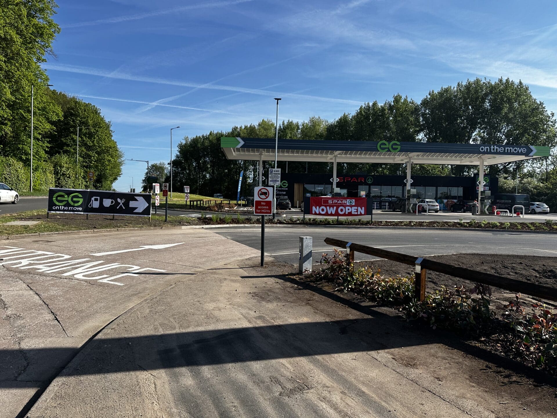 The newly opened Darlaston petrol station at the roundabout, showing fuel pumps, canopy and convenience store in the background on a bright day.
