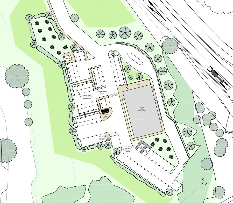 Site layout plan showing the proposed Meaford EV charging hub and drive-through restaurant. Includes 31 EV charging bays, standard car parking spaces, a drive-through lane, picnic area, landscaped sections, and access routes connecting to the A34.