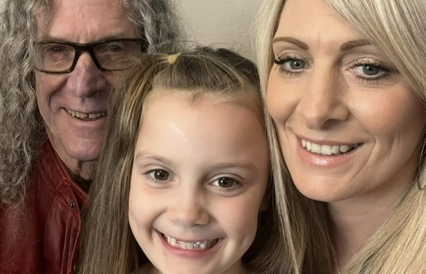 Michael McGowan smiling with his daughter Jodie and granddaughter Olivia in a close-up family photo, taken ahead of their upcoming 5K charity walk in Stone.