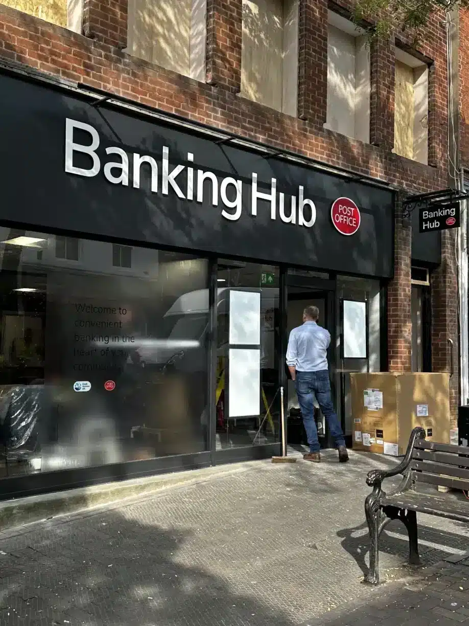 Work in progress outside the new Banking Hub on Stone High Street, showing signage installed and contractors completing the internal fit-out ahead of the July opening.