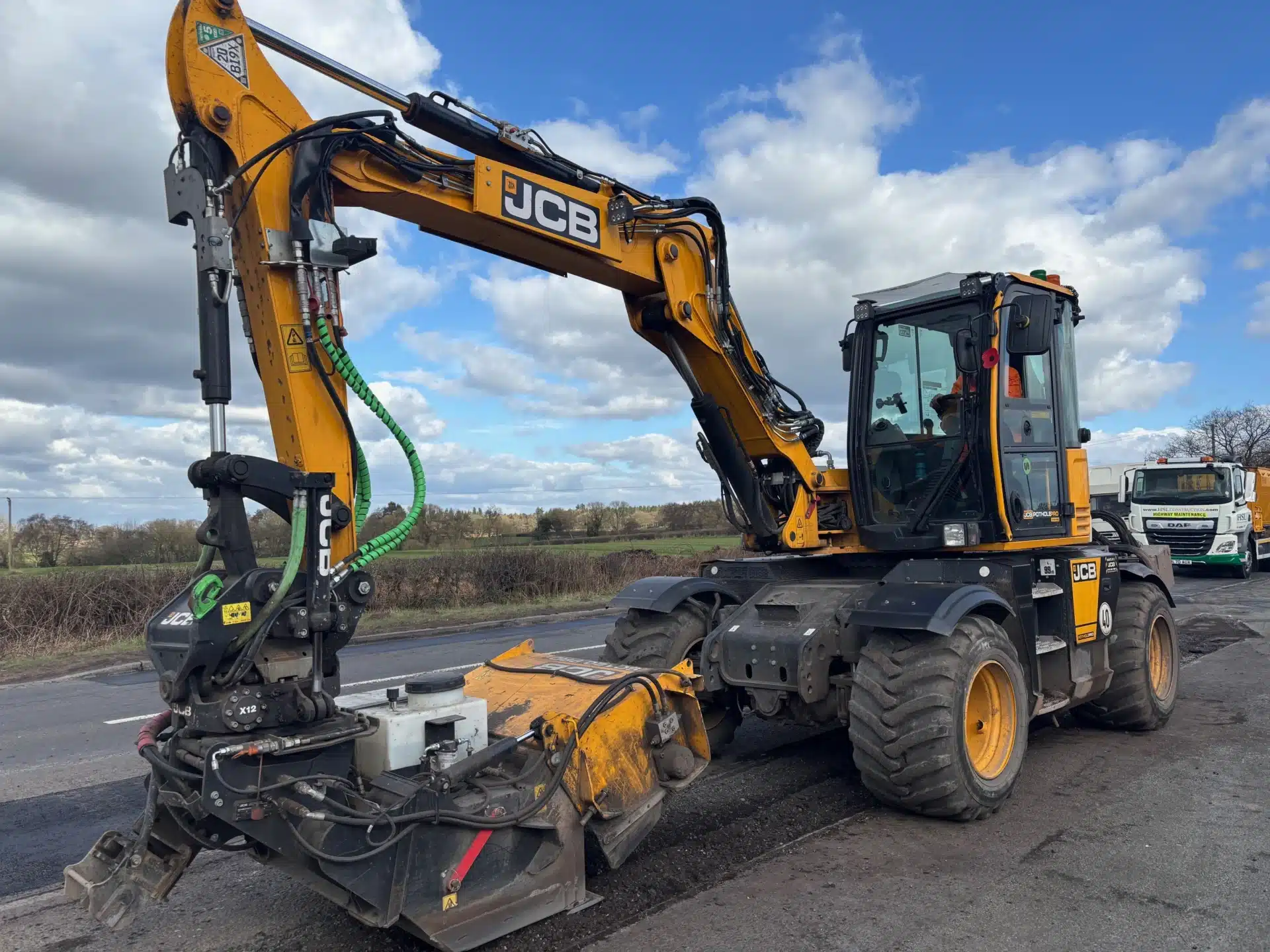 JCB Pothole Pro vehicle repairing a road surface on a sunny day in Staffordshire