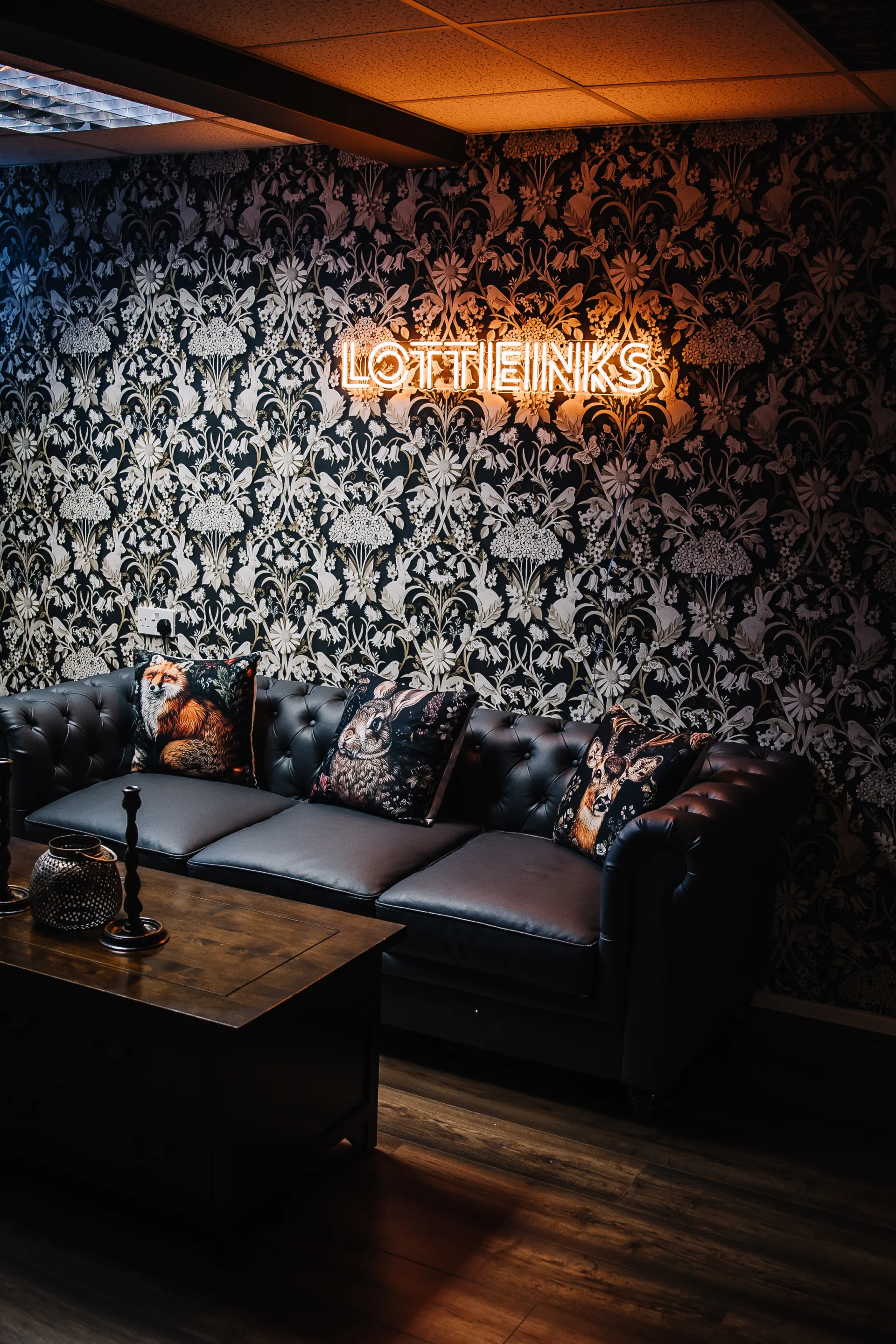 The stylish and serene waiting area at Lottieinks tattoo studio in Stone.