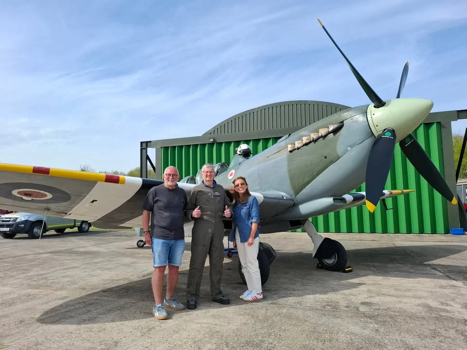 Stone resident Mike Halliday standing beside a World War Two Spitfire at Tattenhill Airfield after his flight experience.