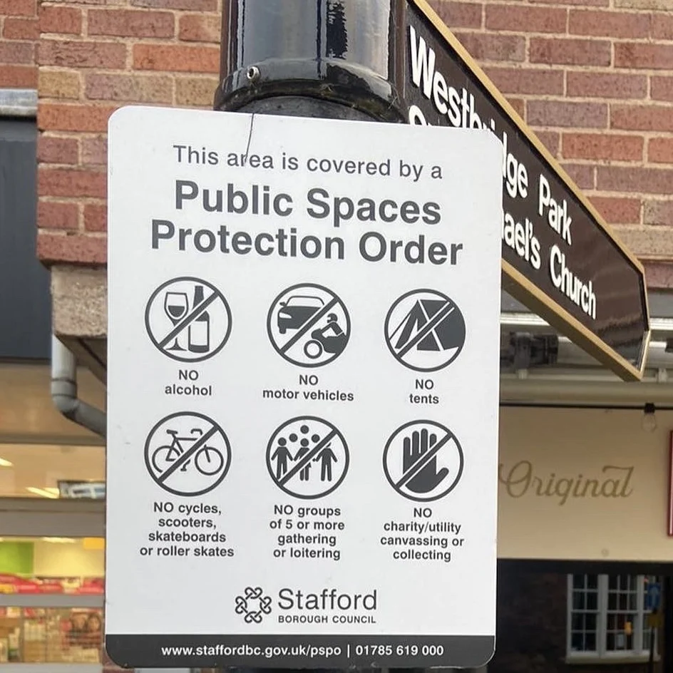 A Public Spaces Protection Order sign in Stone town centre listing restrictions on alcohol, cycles, scooters, vehicles, tents, loitering and canvassing.