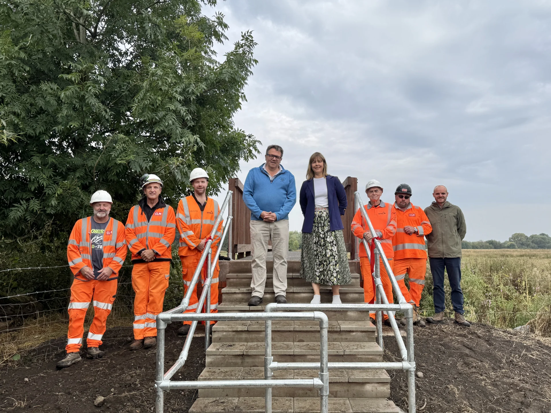 (L-R) Hayley Coles, Andrew Mynors and Hugo Wildblood enjoying the new Burston Bridge with residents