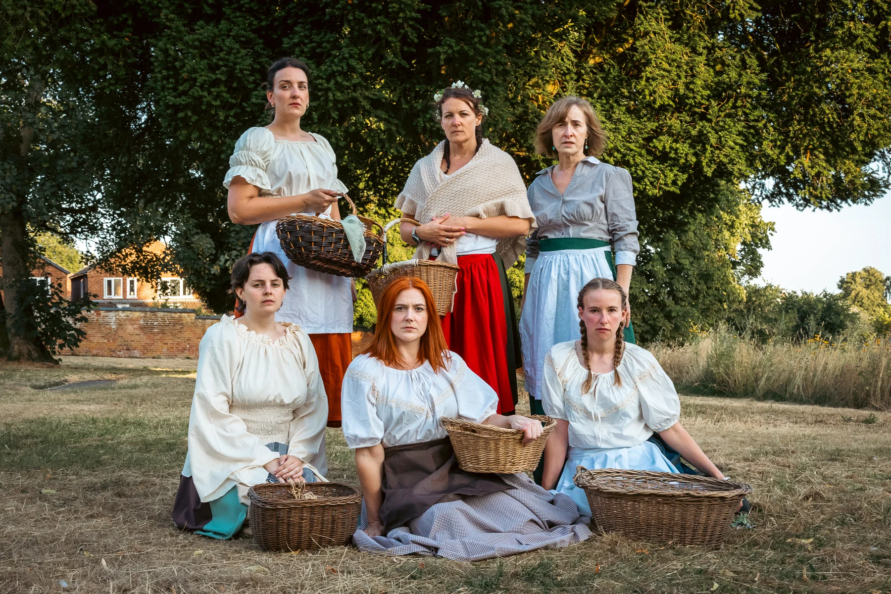 Six cast members of Stone Revellers posed in period costume during preparations for The Ballad of Maria Marten.