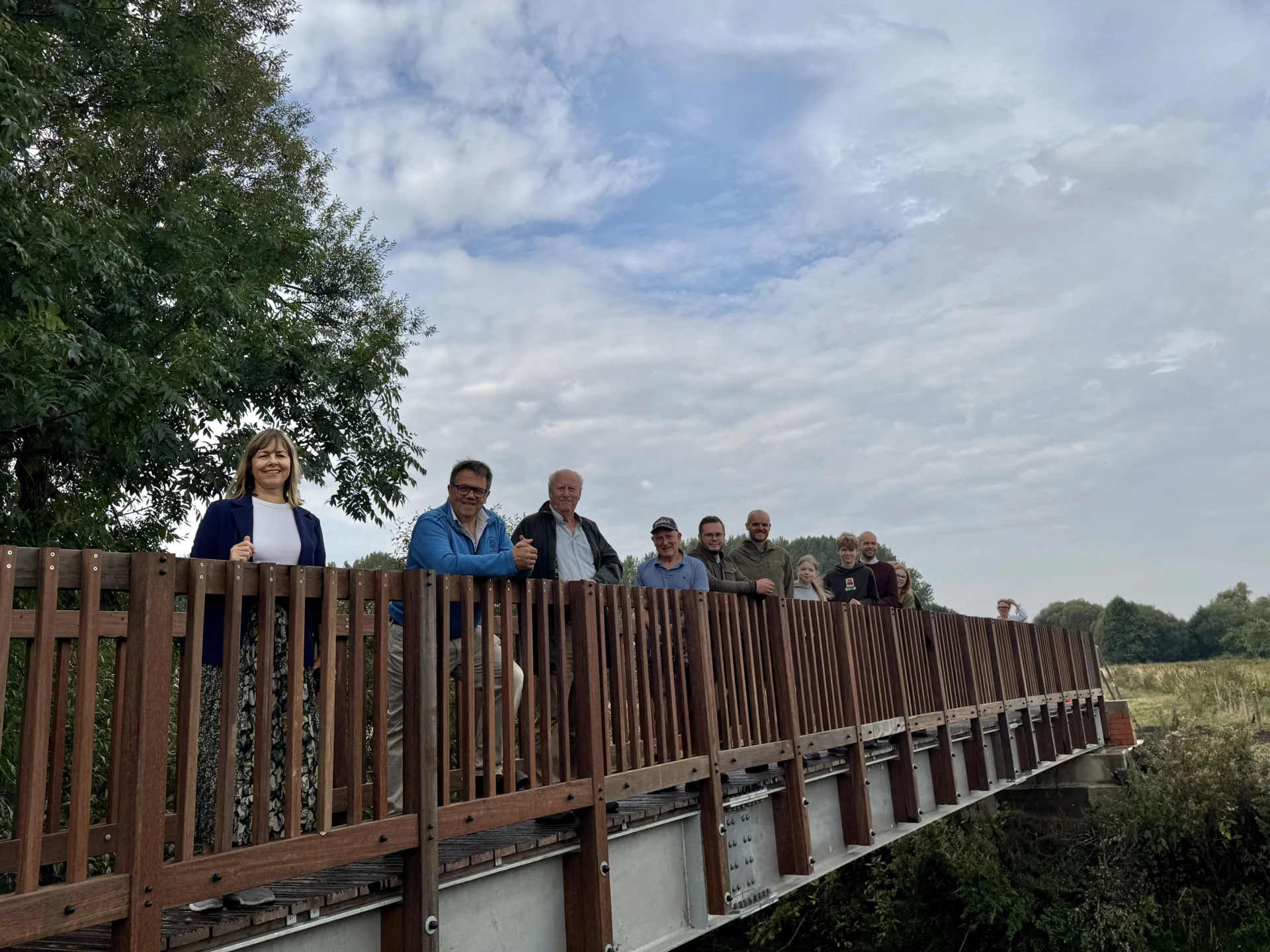 Hayley Coles, Andrew Mynors and Hugo Wildblood with local residents on the newly opened Burston footbridge.