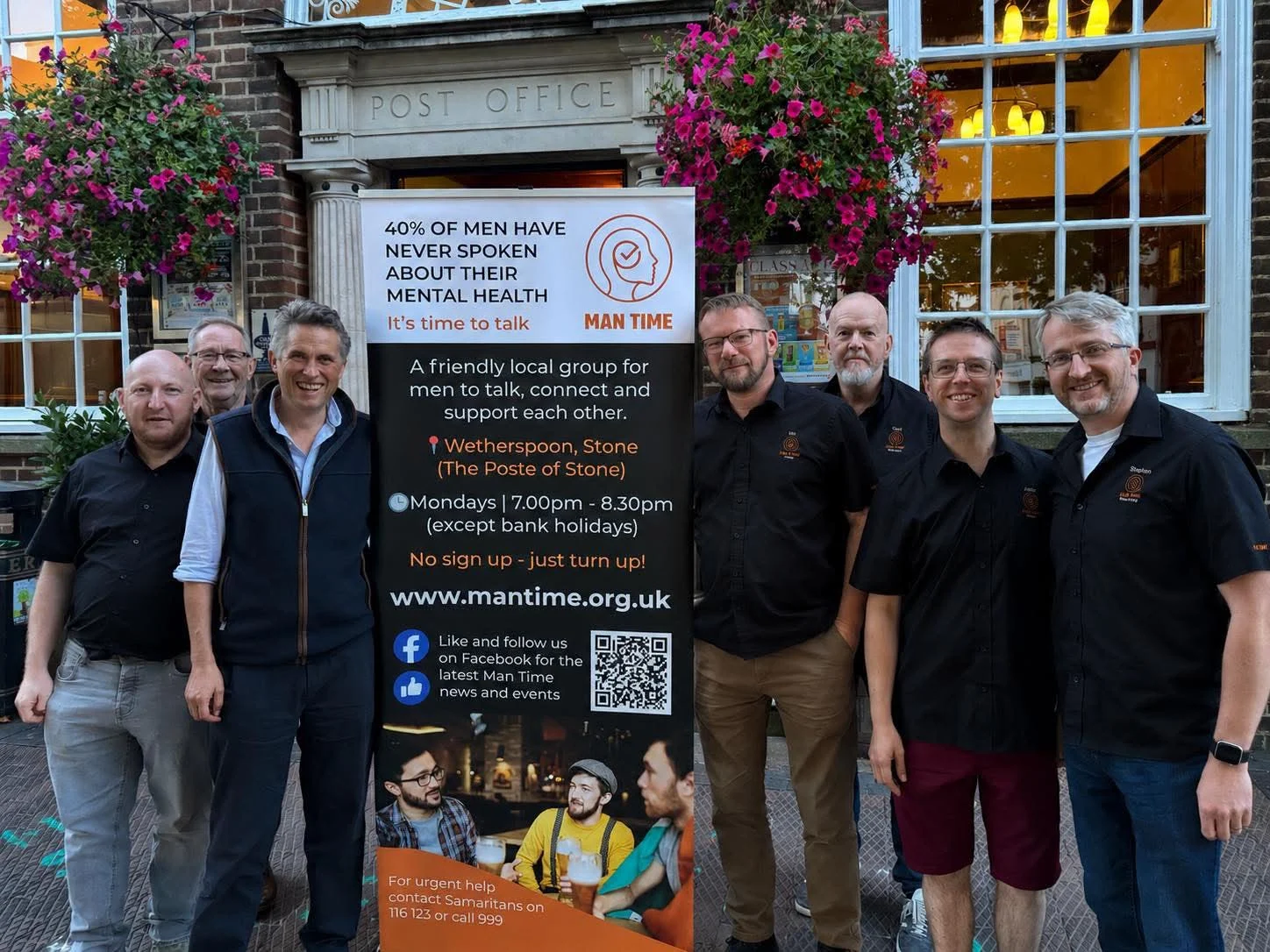 Members of the Man Time team with Sir Gavin Williamson and Stone Town Mayor Councillor Andrew Best in front of The Poste of Stone.