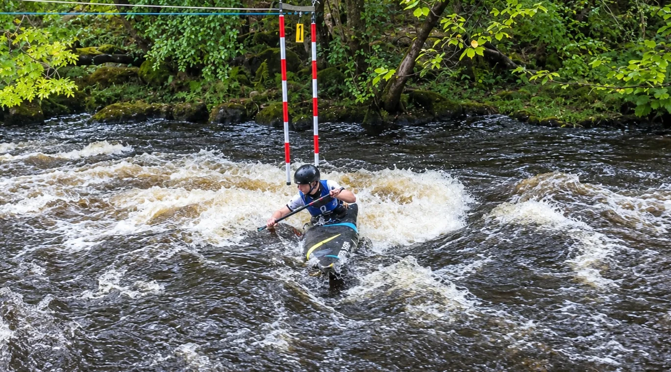 Nathan competing in a canoe slalom event.