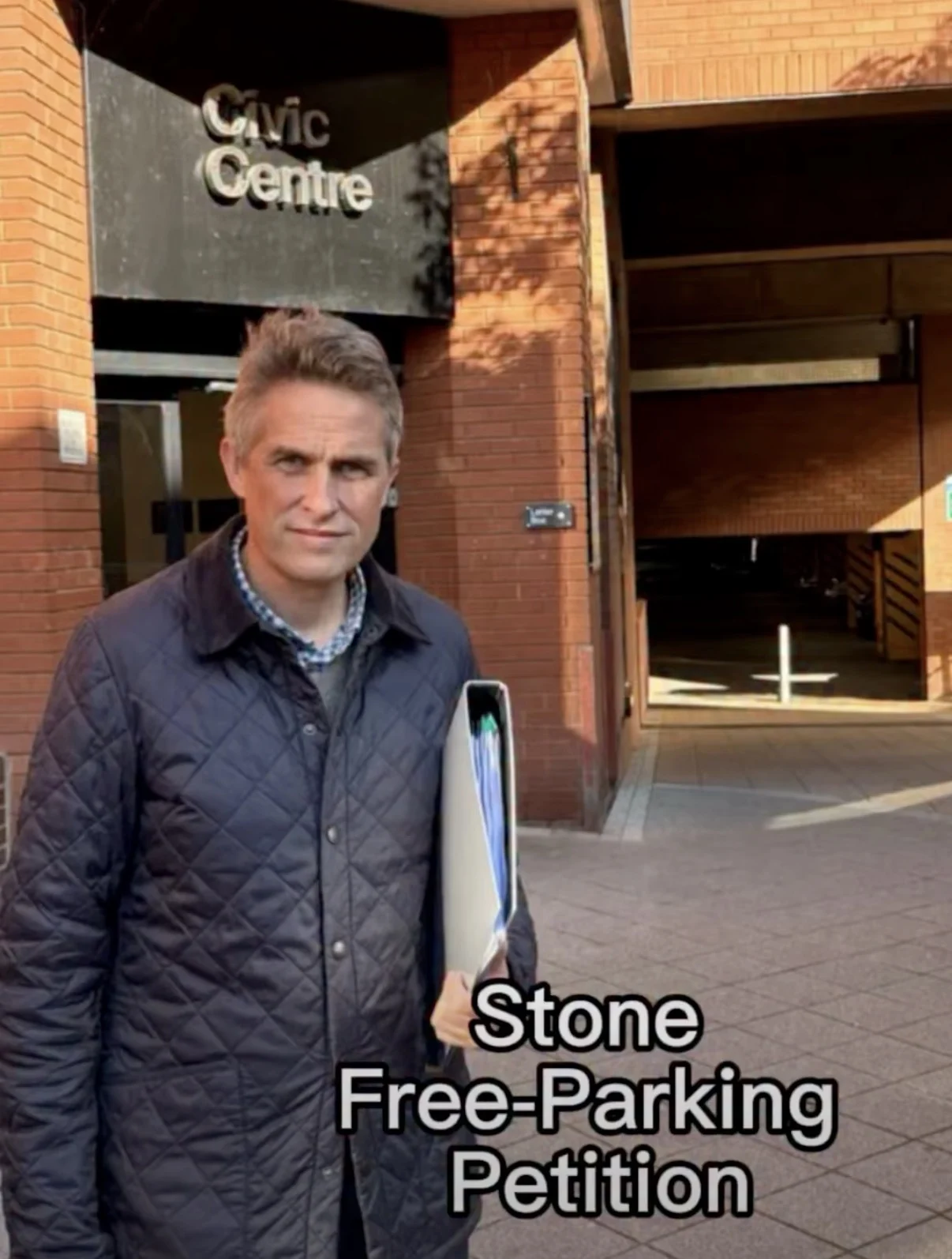 Gavin Williamson with 1800 signature petition outside the Stafford Civic Centre
